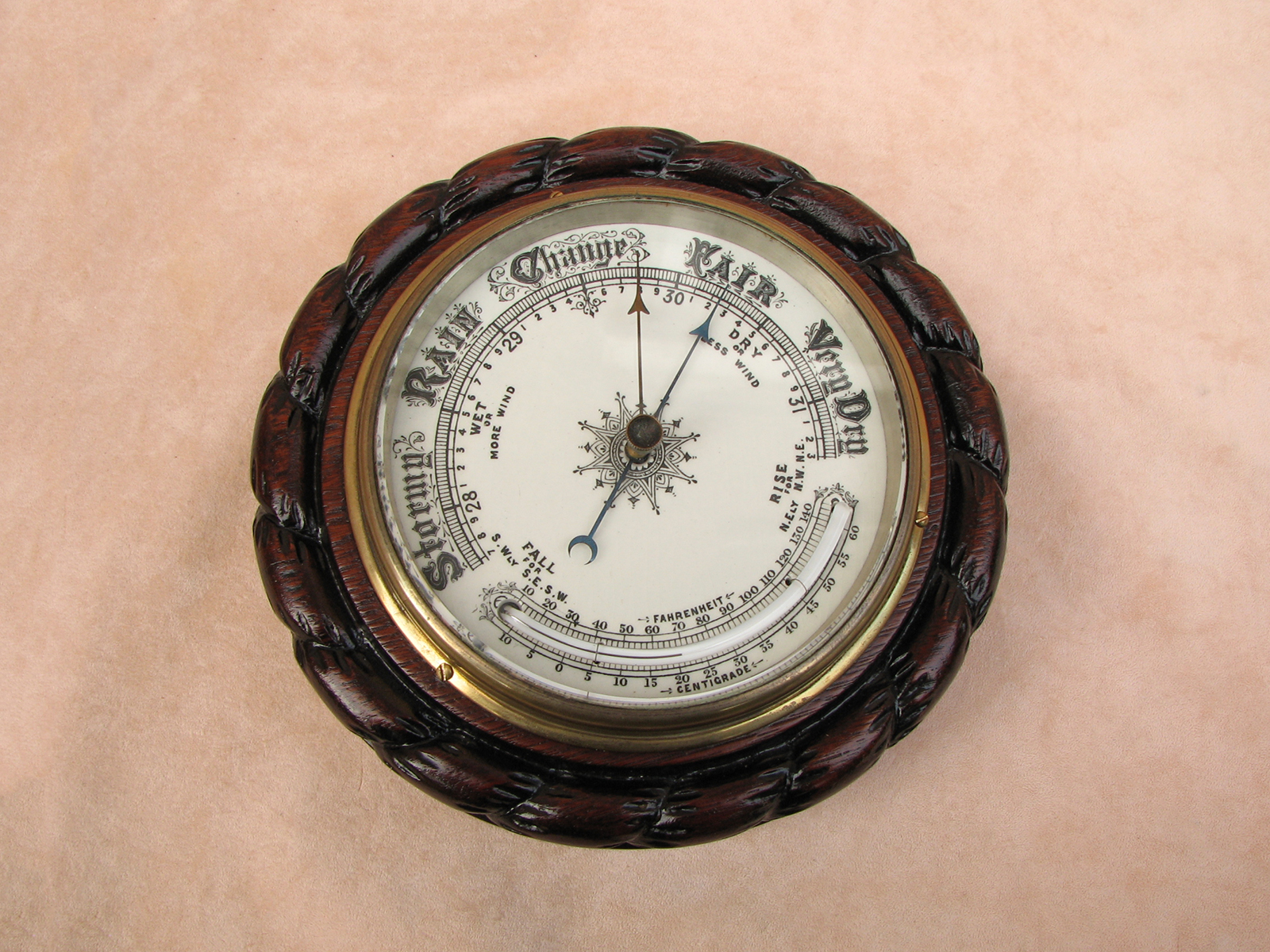 Late 19th century marine barometer in ropetwist carved Oak surround